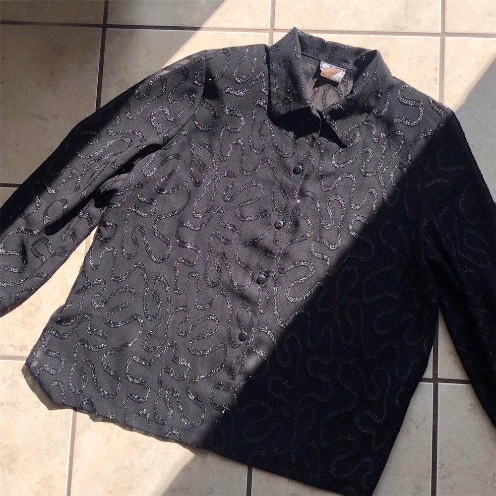 Black sheer blouse with sparkly embroidered motif